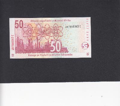 Beschrijving achterzijde: REFINERY